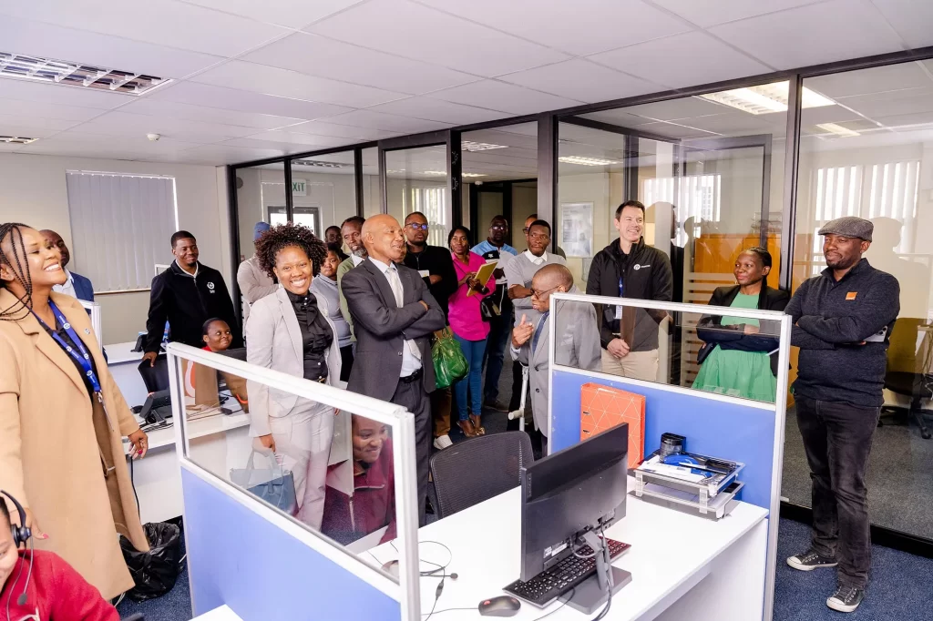 Deputy Permanent Secretary, Cecil Masiga and guests attending tour of the Paratus Office 