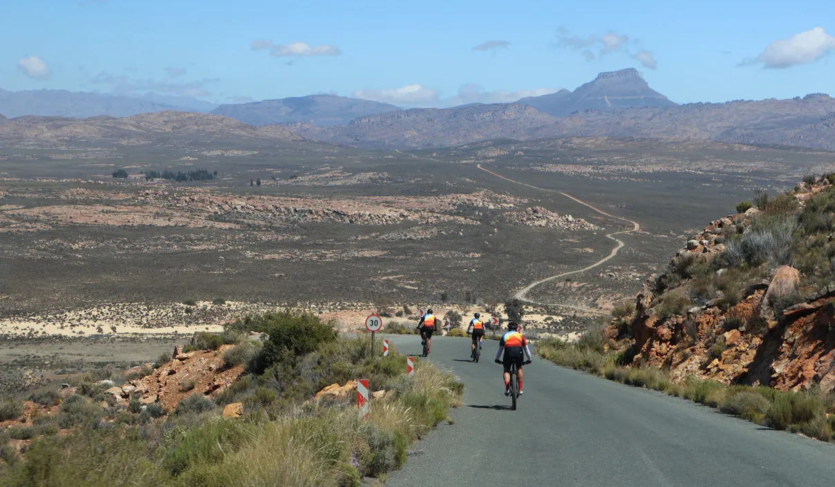 Cyclists riding through the remote Karoo landscape